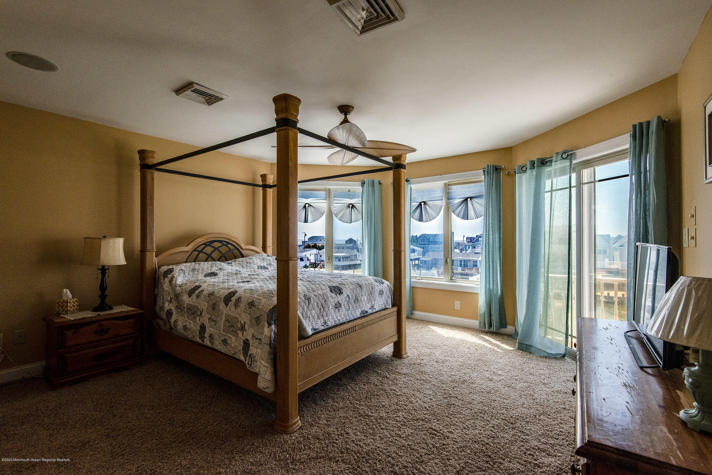 214 Heron Road Tuckerton, NJ 08087 - Photo 21 of 31 a bedroom with a bed and a flat tv screen