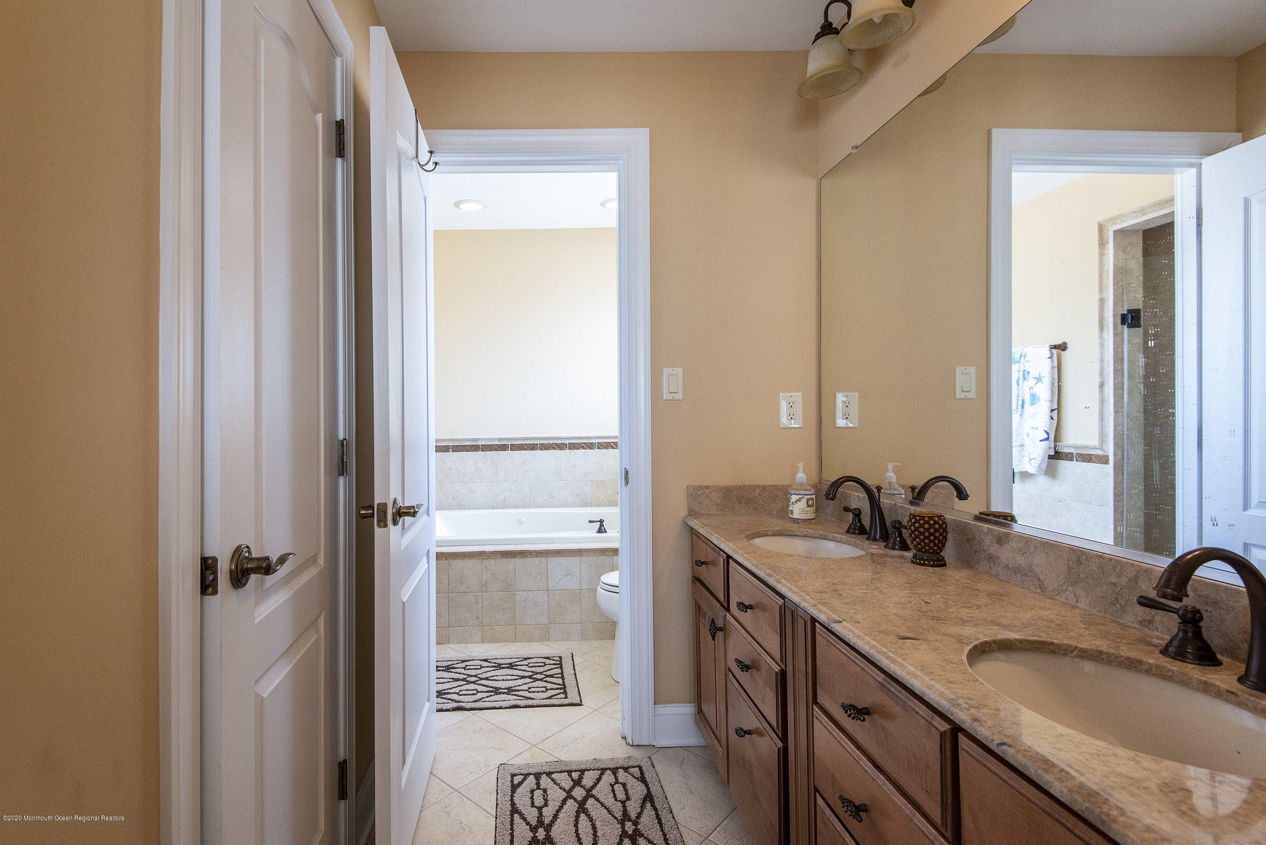 214 Heron Road Tuckerton, NJ 08087 - Photo 22 of 31 a bathroom with a sink and a mirror