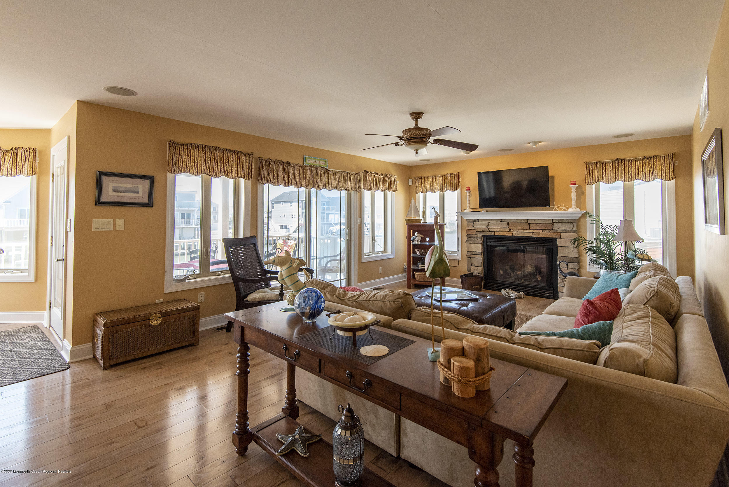 214 Heron Road Tuckerton, NJ 08087 - Photo 4 of 31 a living room with furniture fireplace and a large window