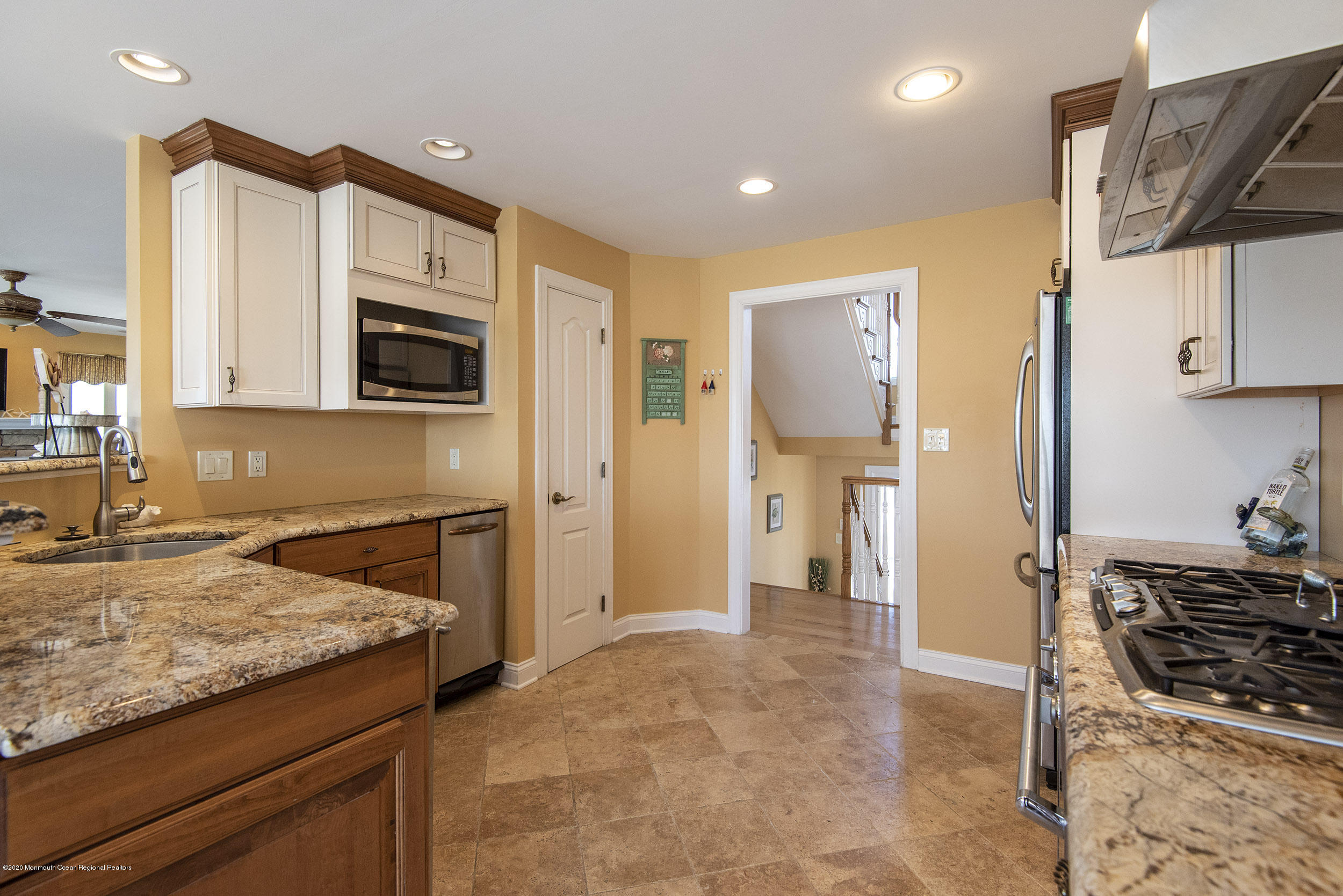 214 Heron Road Tuckerton, NJ 08087 - Photo 7 of 31 a kitchen with stainless steel appliances granite countertop a stove a sink and a refrigerator
