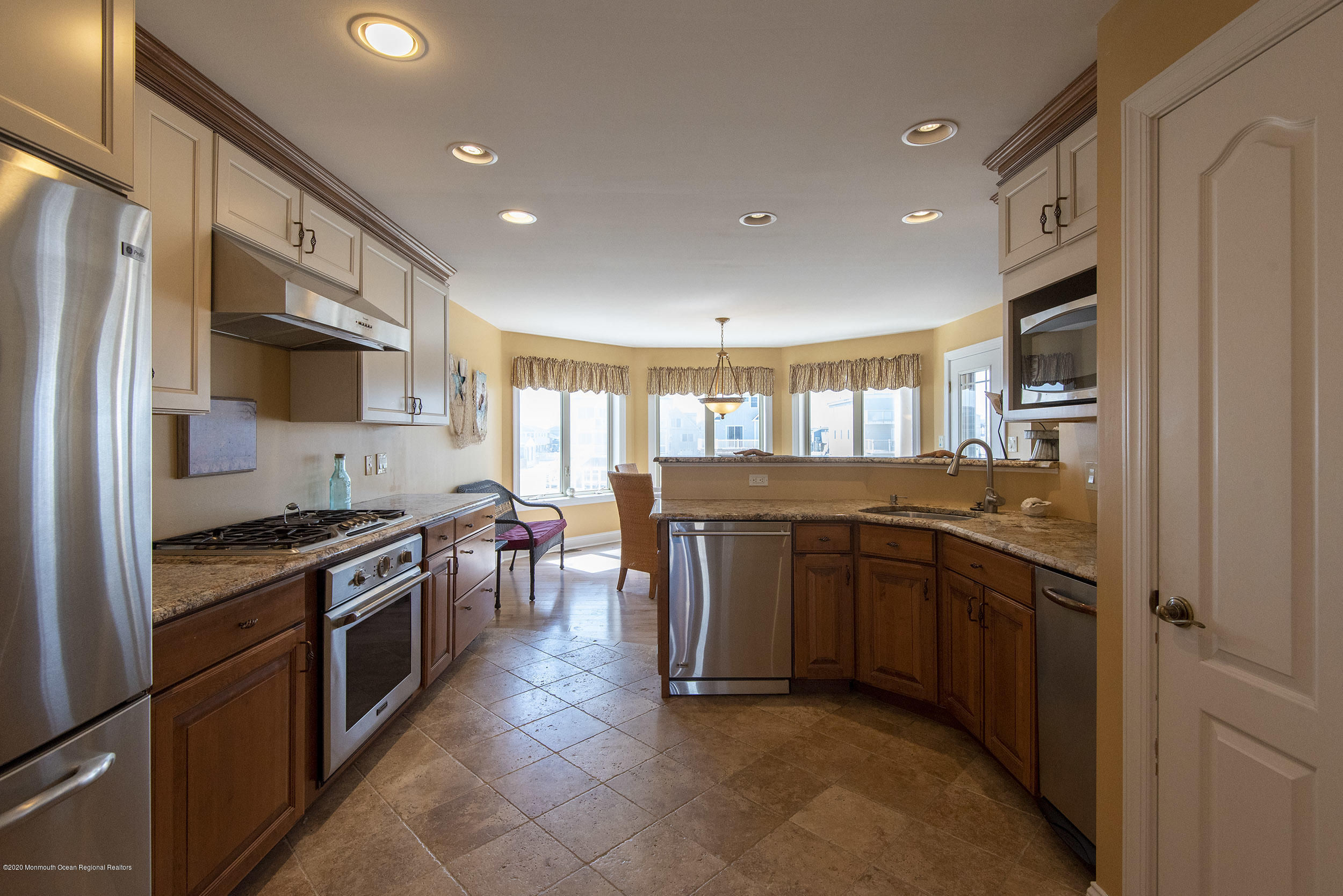 214 Heron Road Tuckerton, NJ 08087 - Photo 8 of 31 a kitchen with stainless steel appliances granite countertop a stove top oven a sink dishwasher a refrigerator and a refrigerator