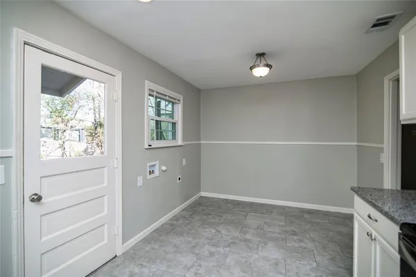 a view of an empty room with a window
