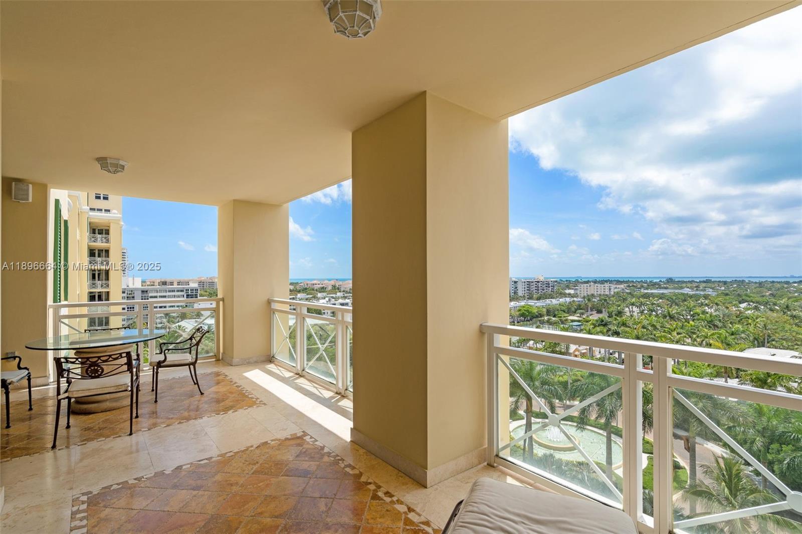 445 Grand Bay Drive, Unit 1001 Key Biscayne, FL 33149 - Photo 12 of 57 a view of a balcony with chairs