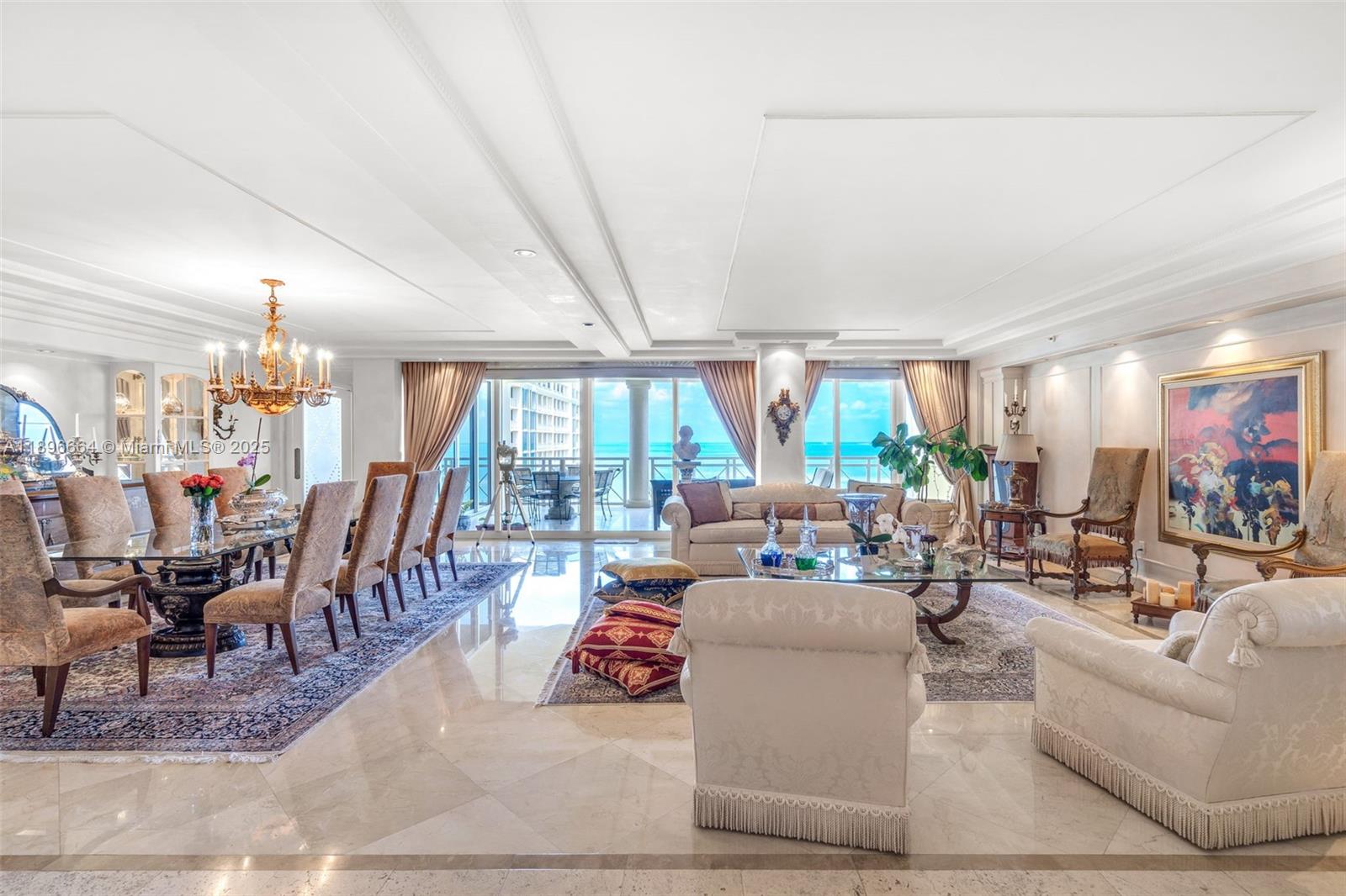 445 Grand Bay Drive, Unit 1001 Key Biscayne, FL 33149 - Photo 15 of 57 a living room with lots of furniture and a large window