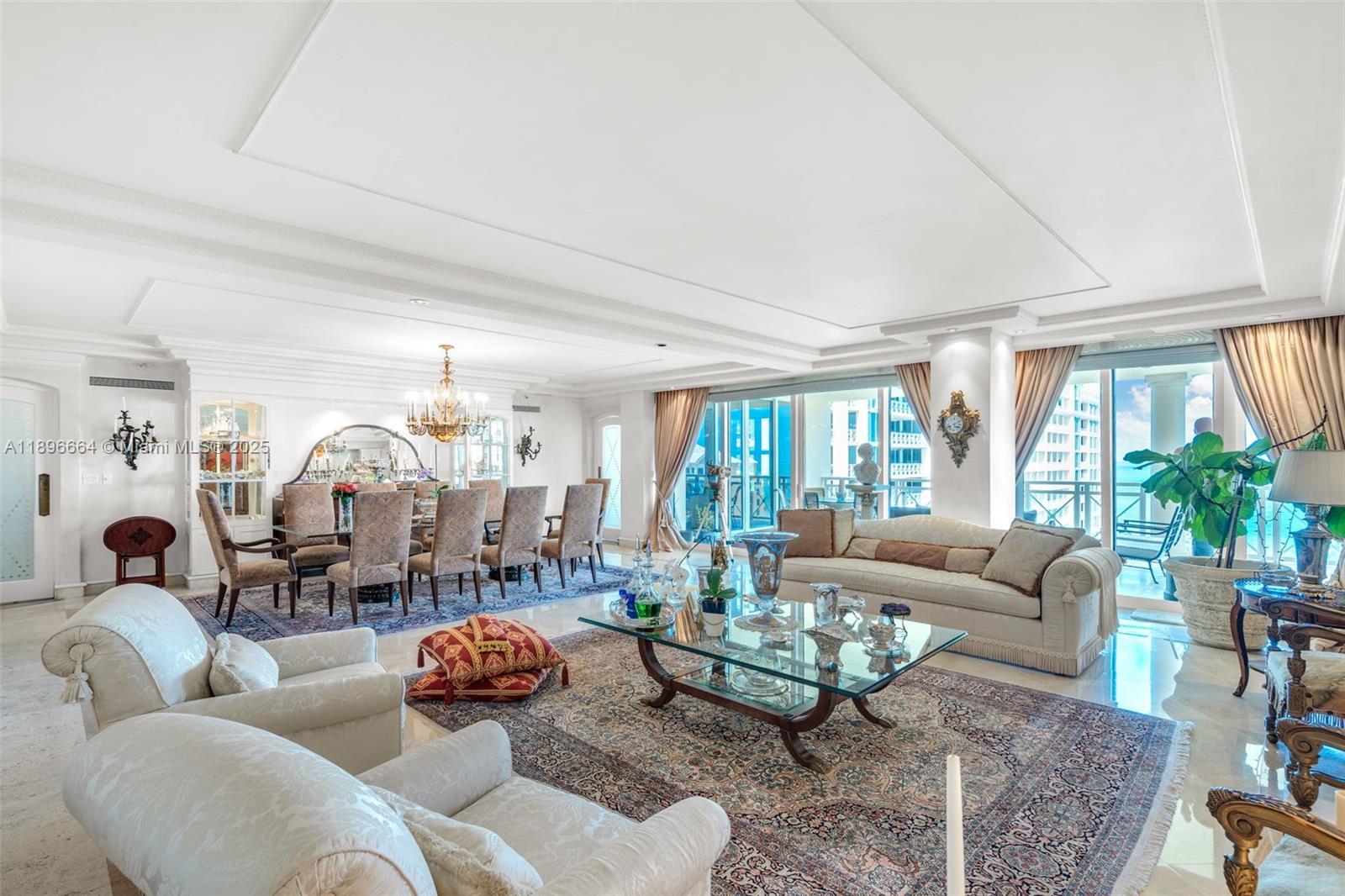 445 Grand Bay Drive, Unit 1001 Key Biscayne, FL 33149 - Photo 16 of 57 a living room with furniture and a large window