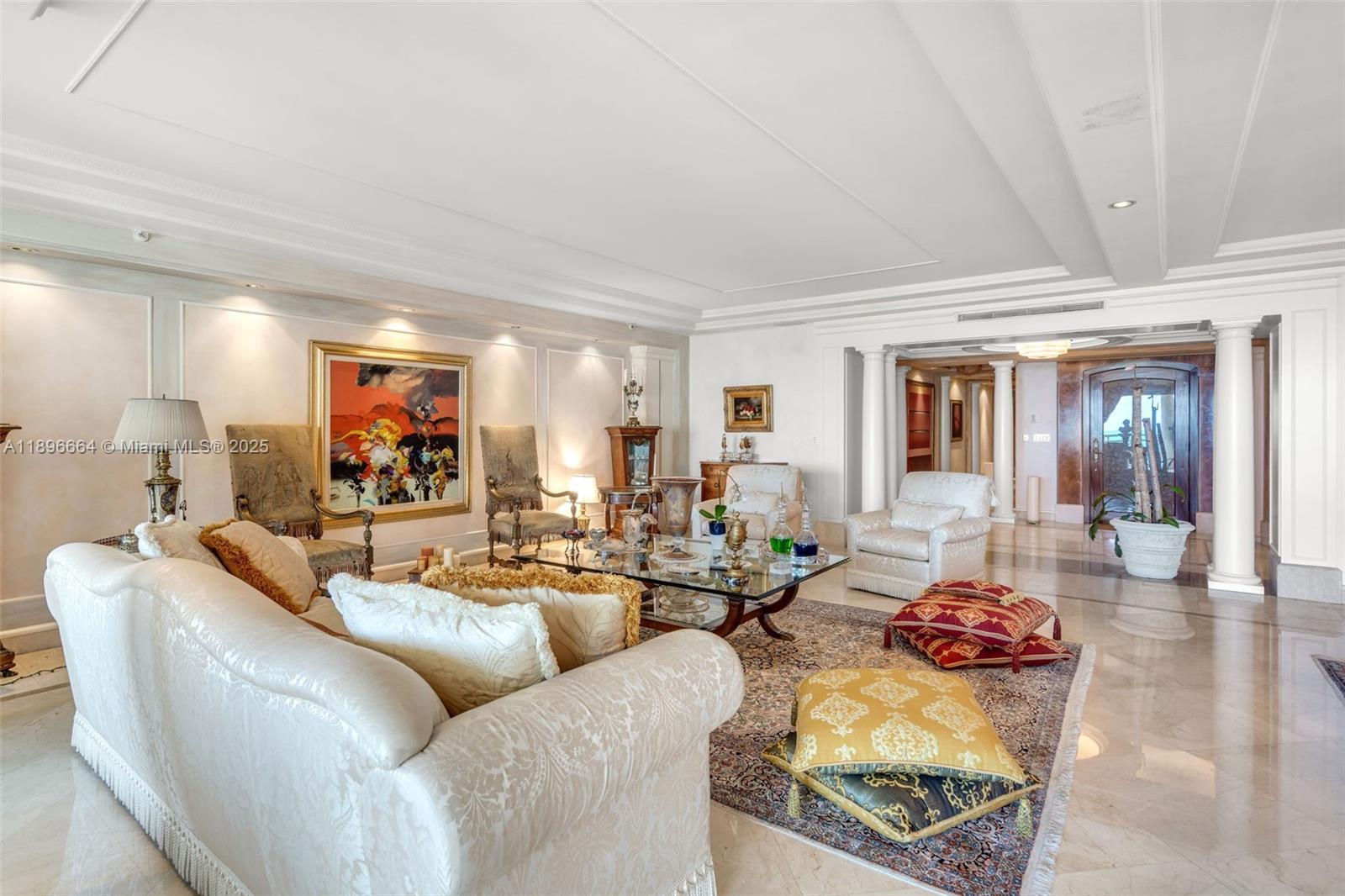 445 Grand Bay Drive, Unit 1001 Key Biscayne, FL 33149 - Photo 17 of 57 a living room with furniture and a wooden floor