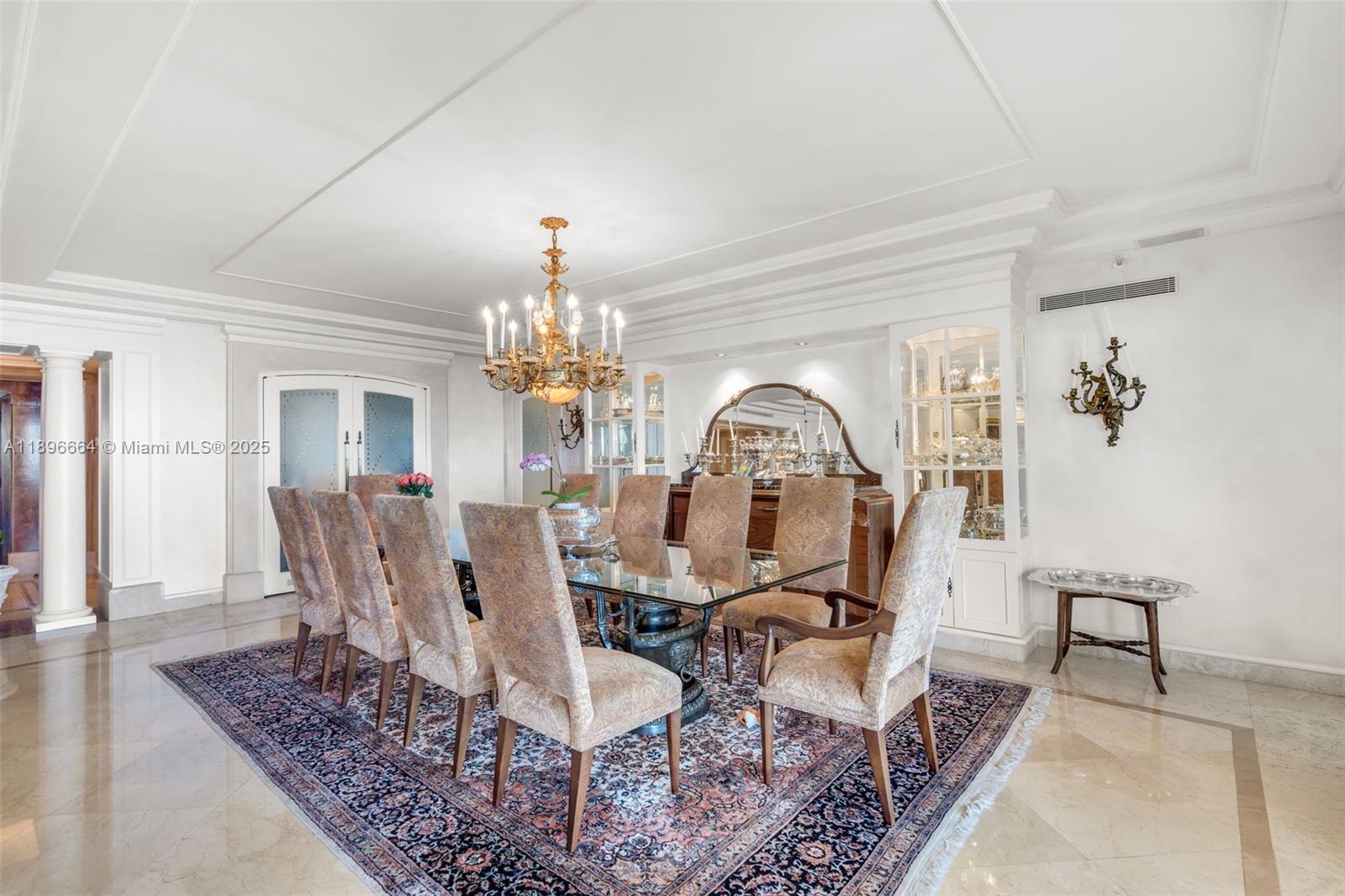 445 Grand Bay Drive, Unit 1001 Key Biscayne, FL 33149 - Photo 19 of 57 a view of a livingroom with furniture chandelier and wooden floor