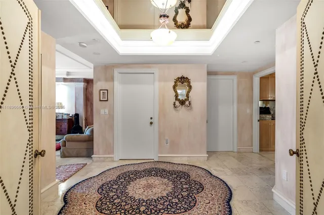 a living room with furniture gym equipment and a large window