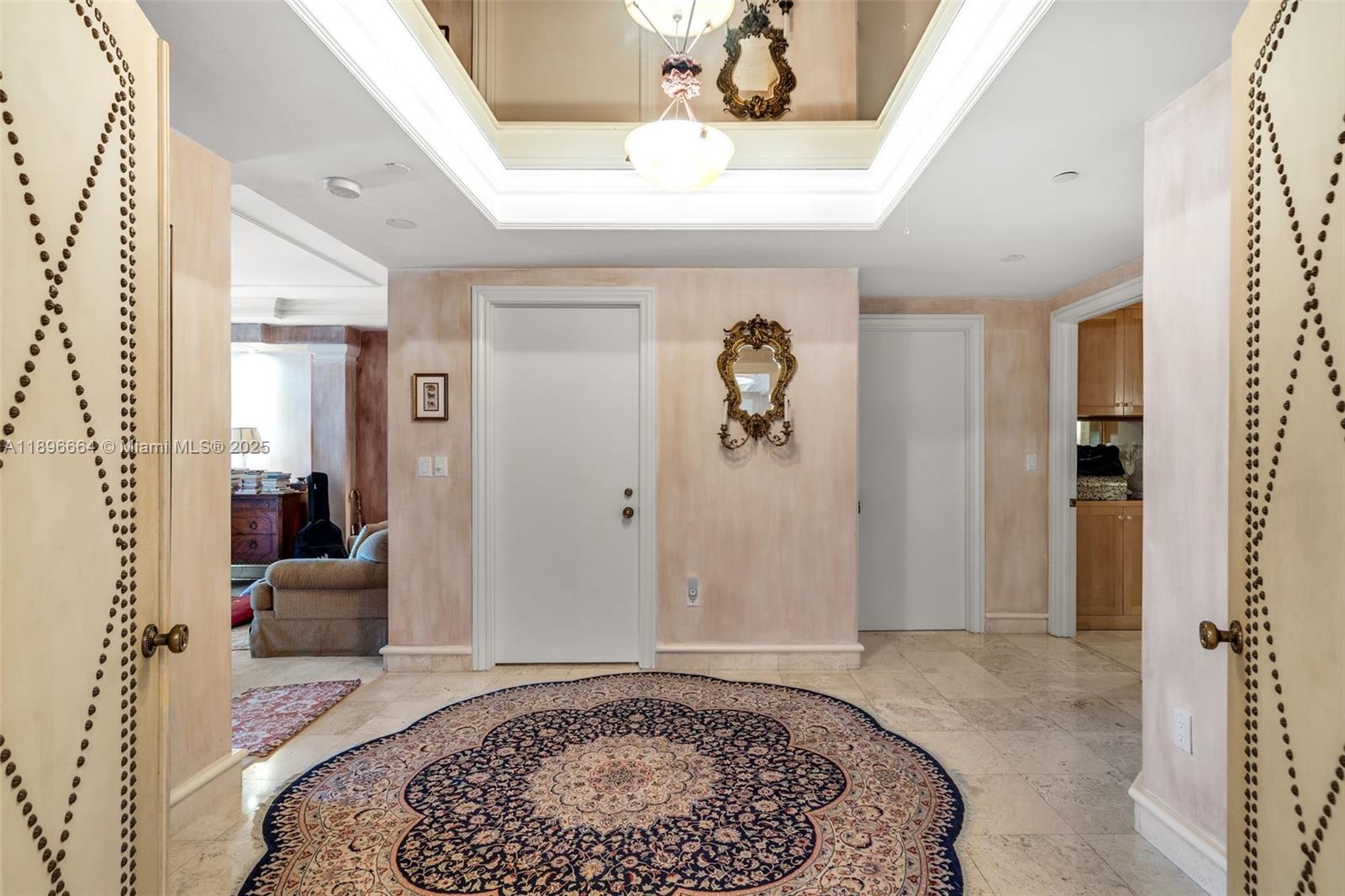 445 Grand Bay Drive, Unit 1001 Key Biscayne, FL 33149 - Photo 29 of 57 a view of an entryway with wooden floor