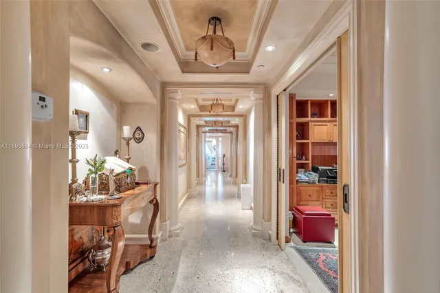 a bathroom with a toilet a sink a large mirror and shower