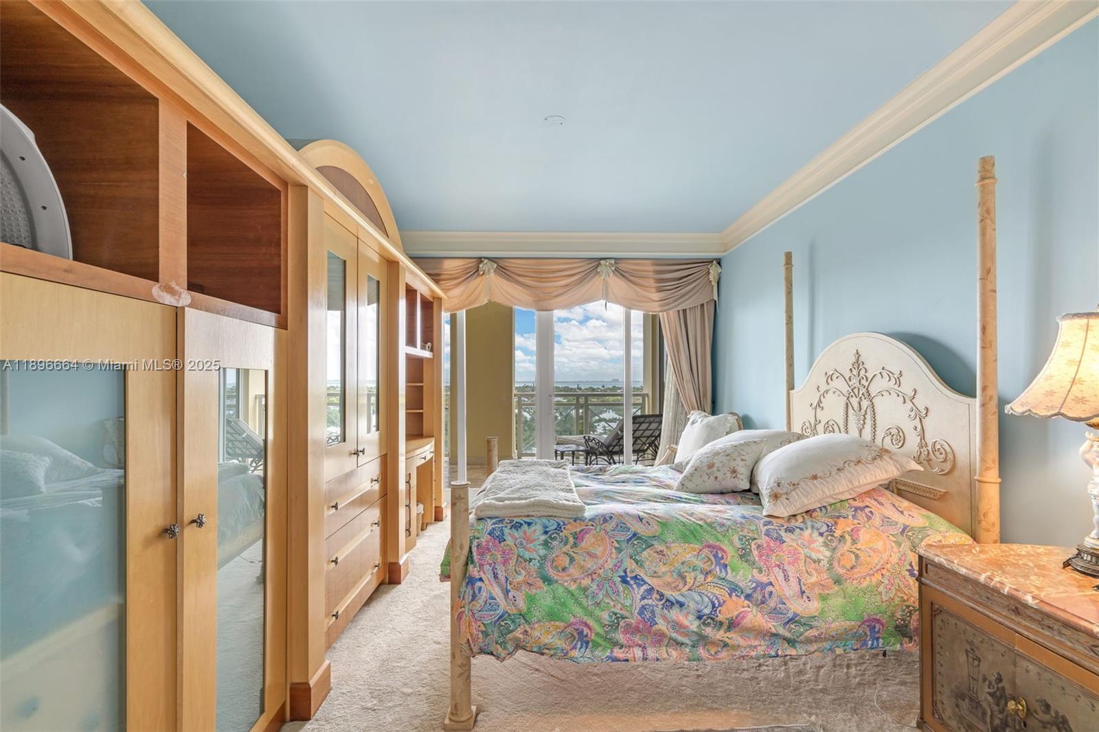 445 Grand Bay Drive, Unit 1001 Key Biscayne, FL 33149 - Photo 39 of 57 a bedroom with furniture and a large window