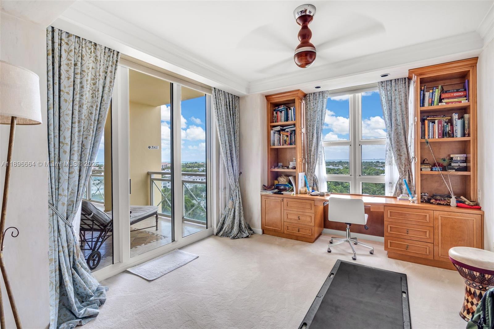 445 Grand Bay Drive, Unit 1001 Key Biscayne, FL 33149 - Photo 42 of 57 a living room with furniture and a window