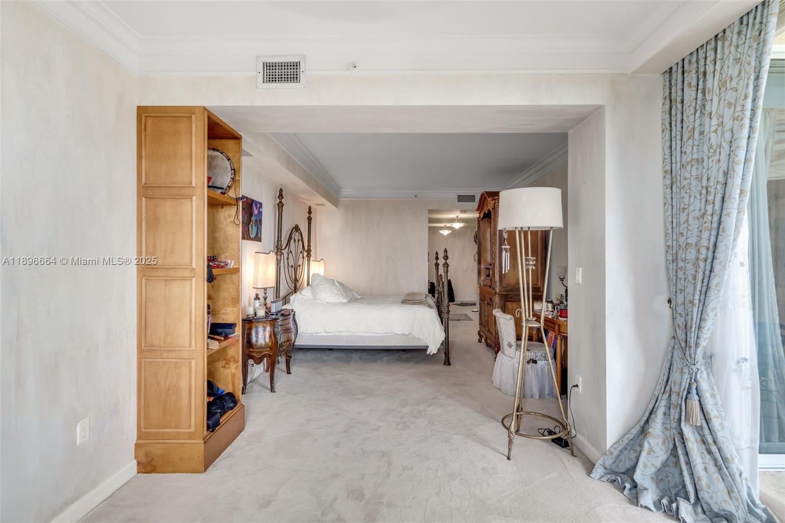 445 Grand Bay Drive, Unit 1001 Key Biscayne, FL 33149 - Photo 43 of 57 a living room with furniture and a walk in closet