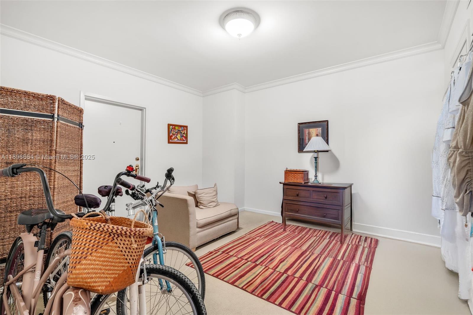 445 Grand Bay Drive, Unit 1001 Key Biscayne, FL 33149 - Photo 46 of 57 a living room with furniture and a wooden floor