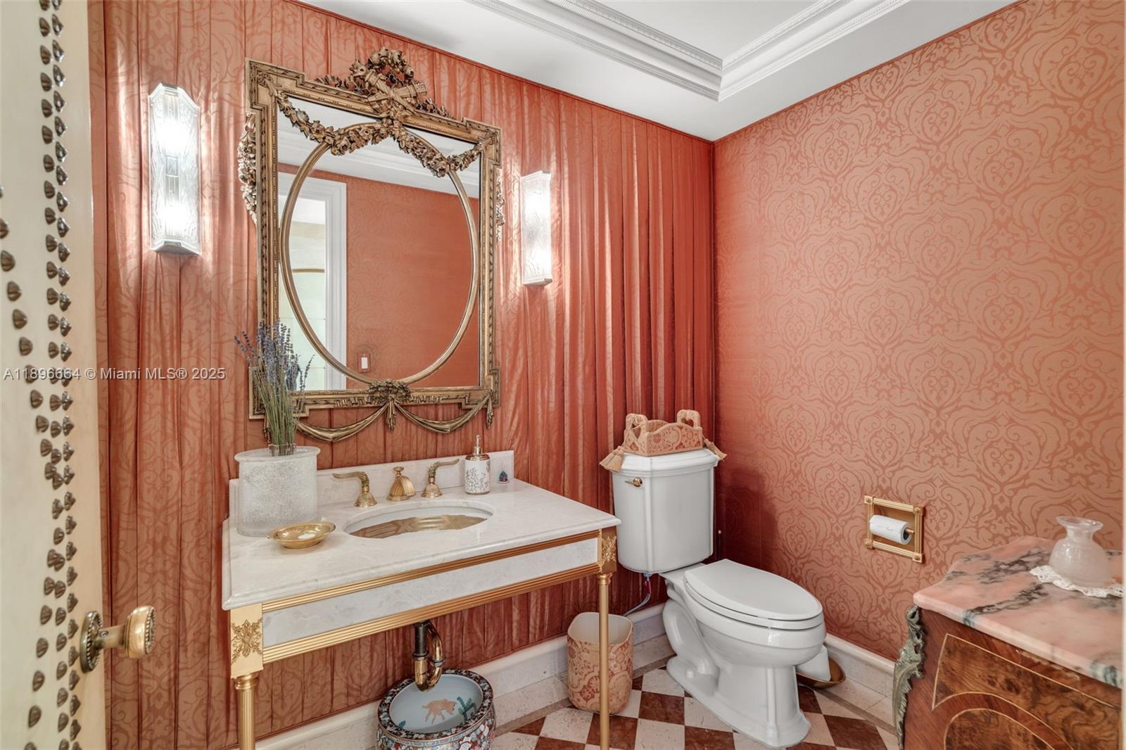 445 Grand Bay Drive, Unit 1001 Key Biscayne, FL 33149 - Photo 47 of 57 a bathroom with a sink vanity mirror and toilet