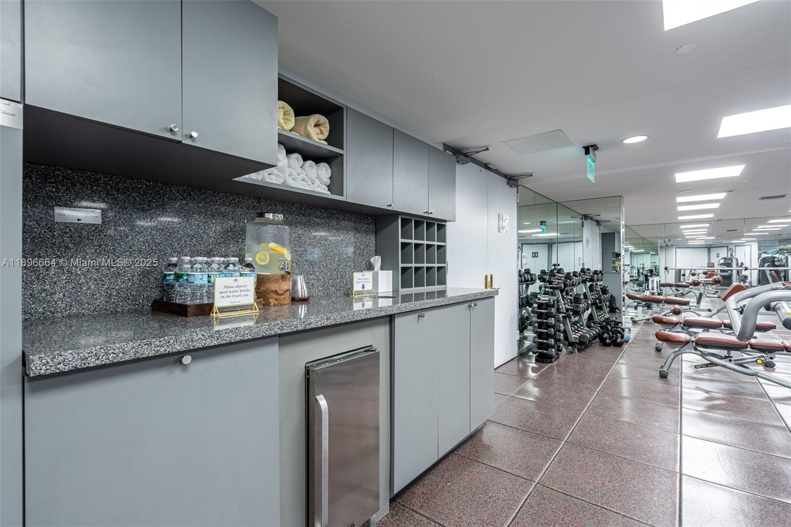 445 Grand Bay Drive, Unit 1001 Key Biscayne, FL 33149 - Photo 51 of 57 a kitchen with stainless steel appliances granite countertop a sink counter top space and cabinets