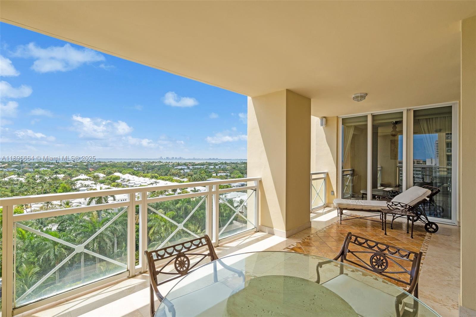 445 Grand Bay Drive, Unit 1001 Key Biscayne, FL 33149 - Photo 10 of 57 a view of a balcony with chair and a table