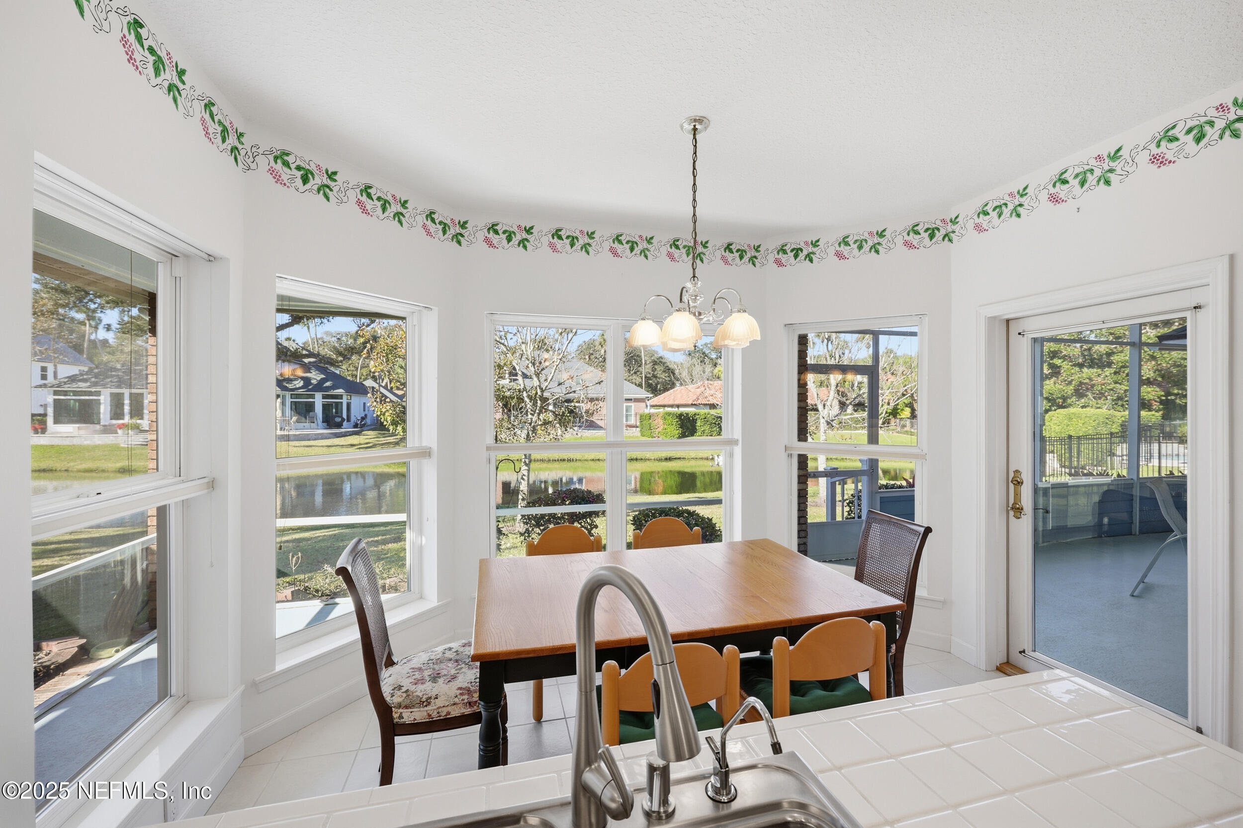 2332 Fiddlers Lane Atlantic Beach, FL 32233 - Photo 21 of 56 a view of a dining room with furniture window and outside view