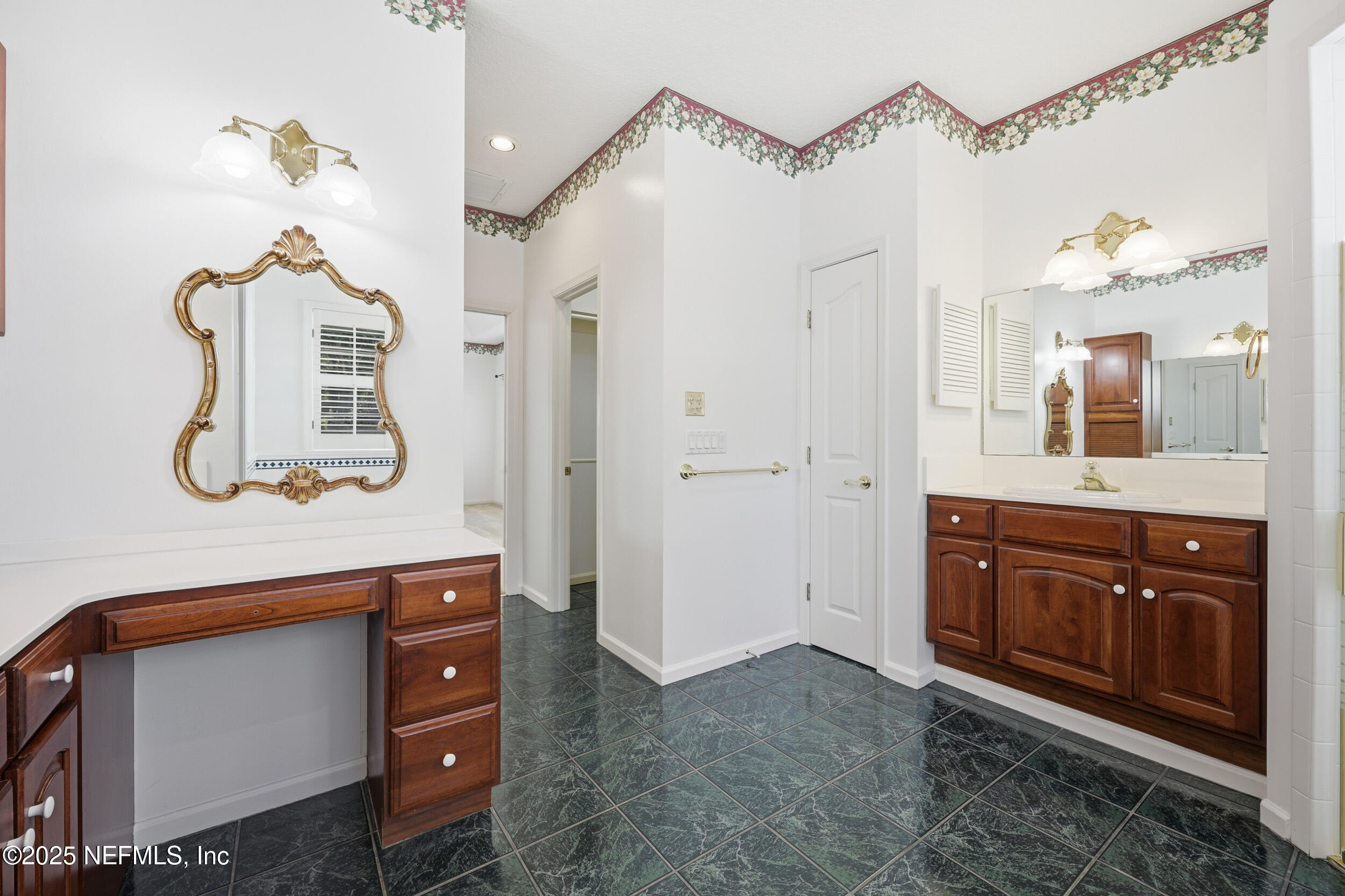 2332 Fiddlers Lane Atlantic Beach, FL 32233 - Photo 27 of 56 a bathroom with a sink a mirror and a shower