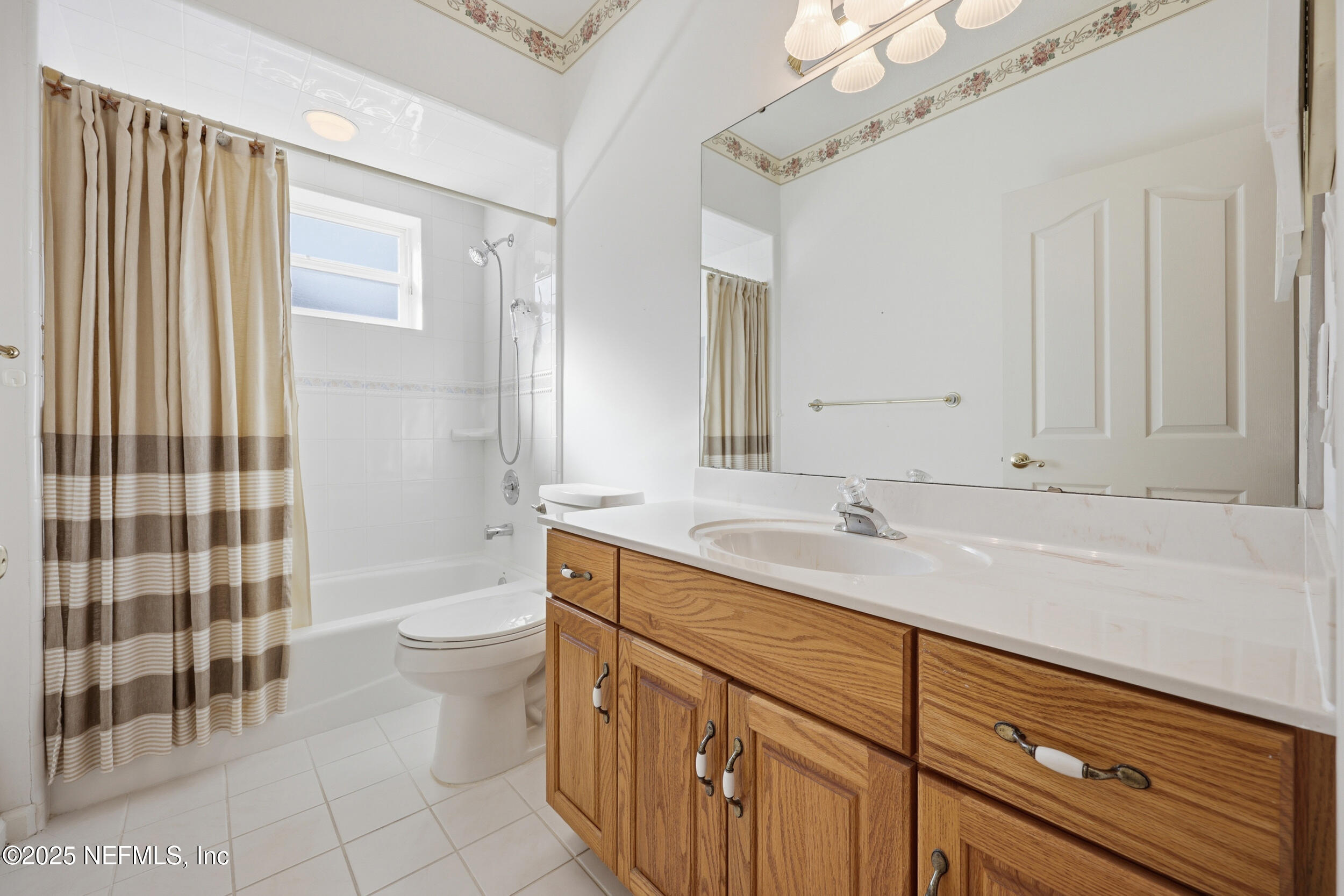 2332 Fiddlers Lane Atlantic Beach, FL 32233 - Photo 33 of 56 a bathroom with a sink a toilet and shower