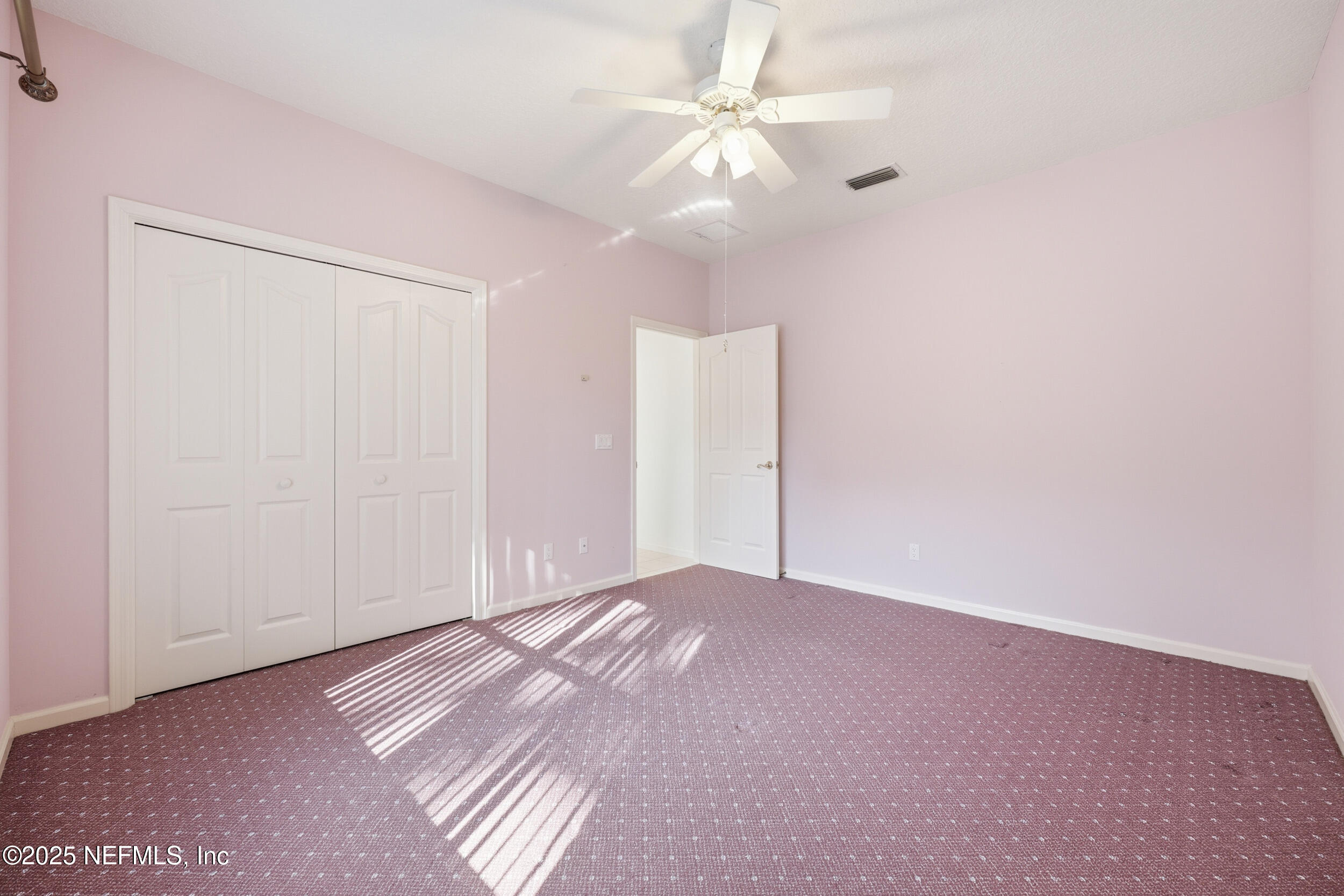 2332 Fiddlers Lane Atlantic Beach, FL 32233 - Photo 35 of 56 an empty room with chandelier fan