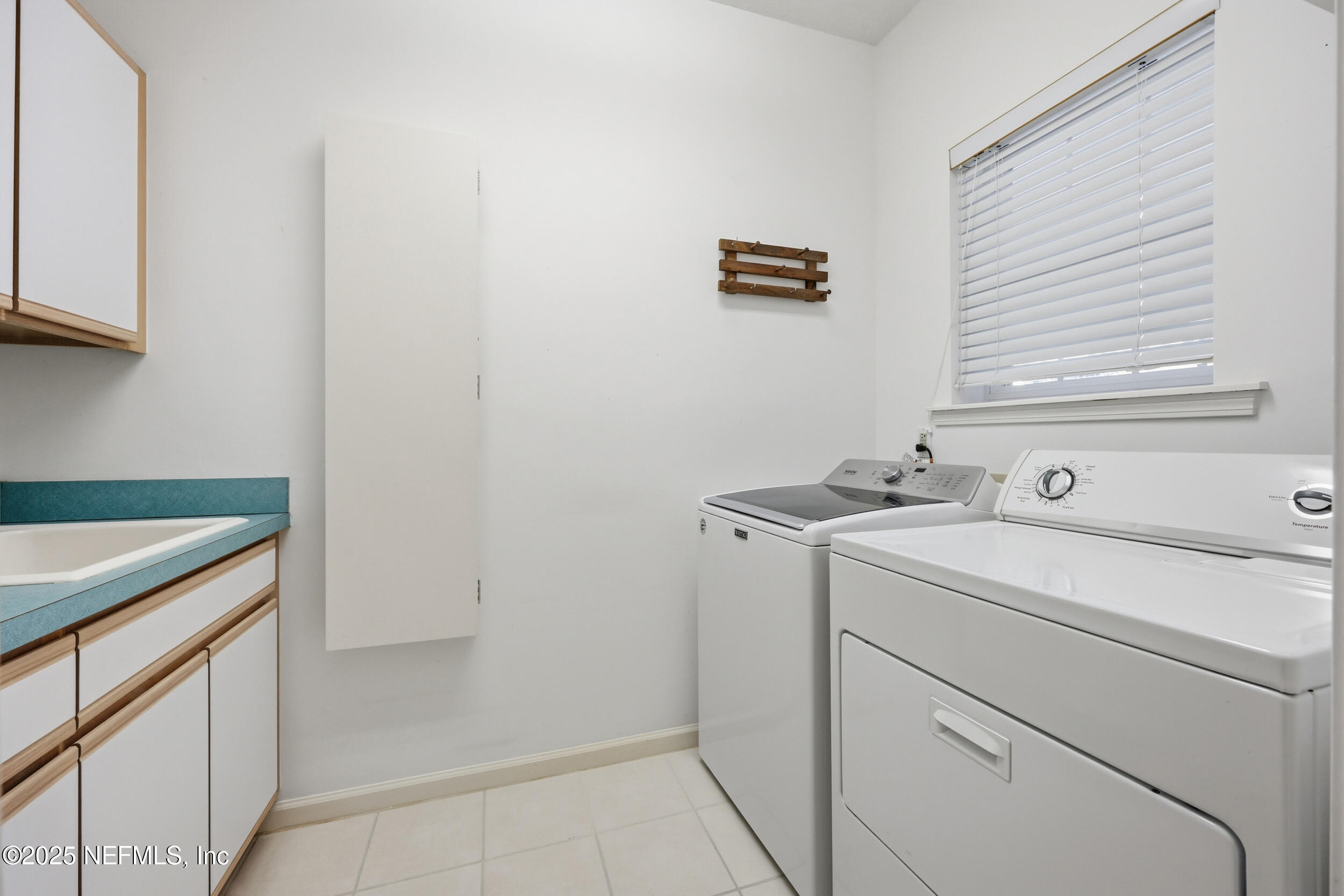 2332 Fiddlers Lane Atlantic Beach, FL 32233 - Photo 37 of 56 a utility room with dryer and washer