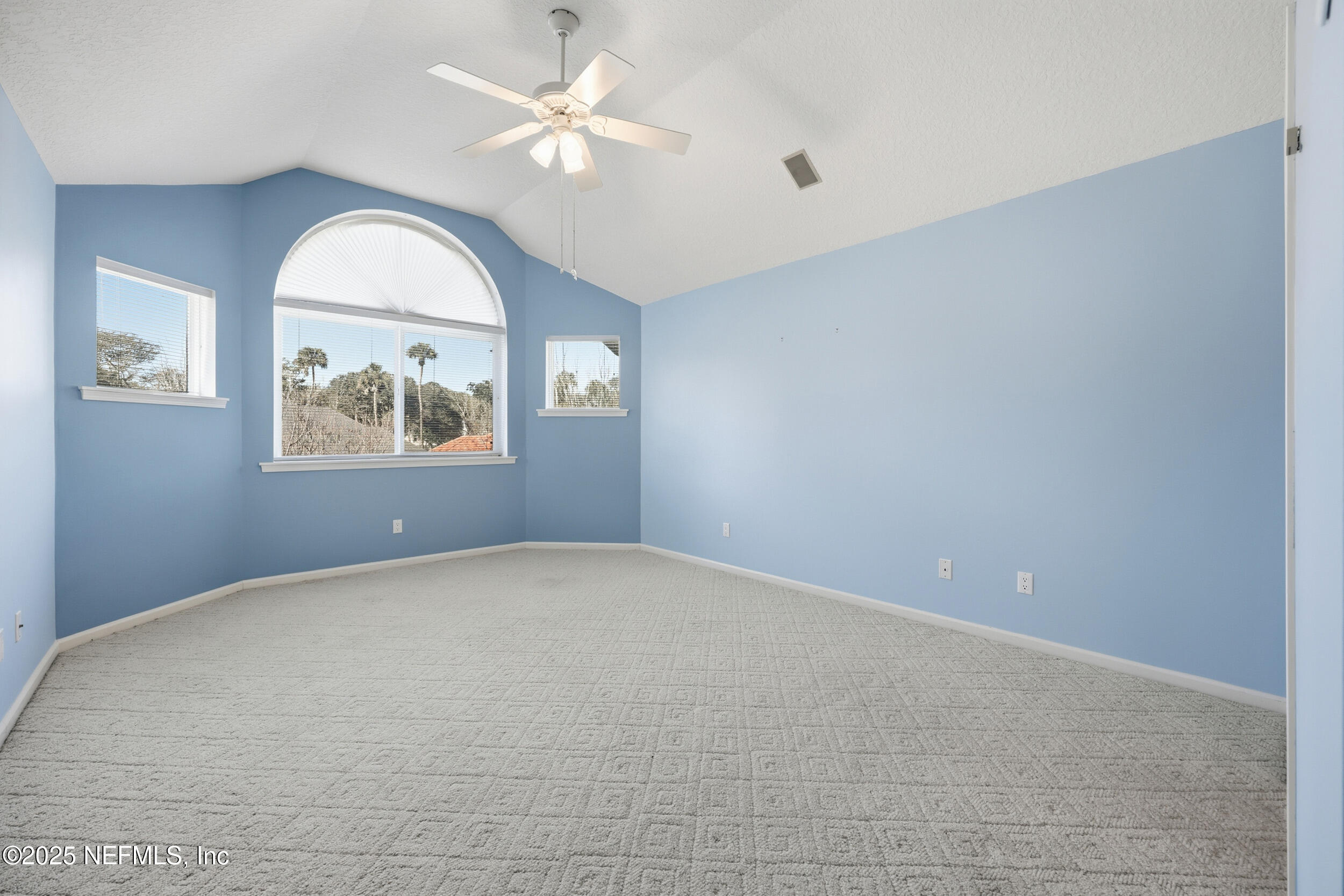 2332 Fiddlers Lane Atlantic Beach, FL 32233 - Photo 39 of 56 an empty room with windows and ceiling fan