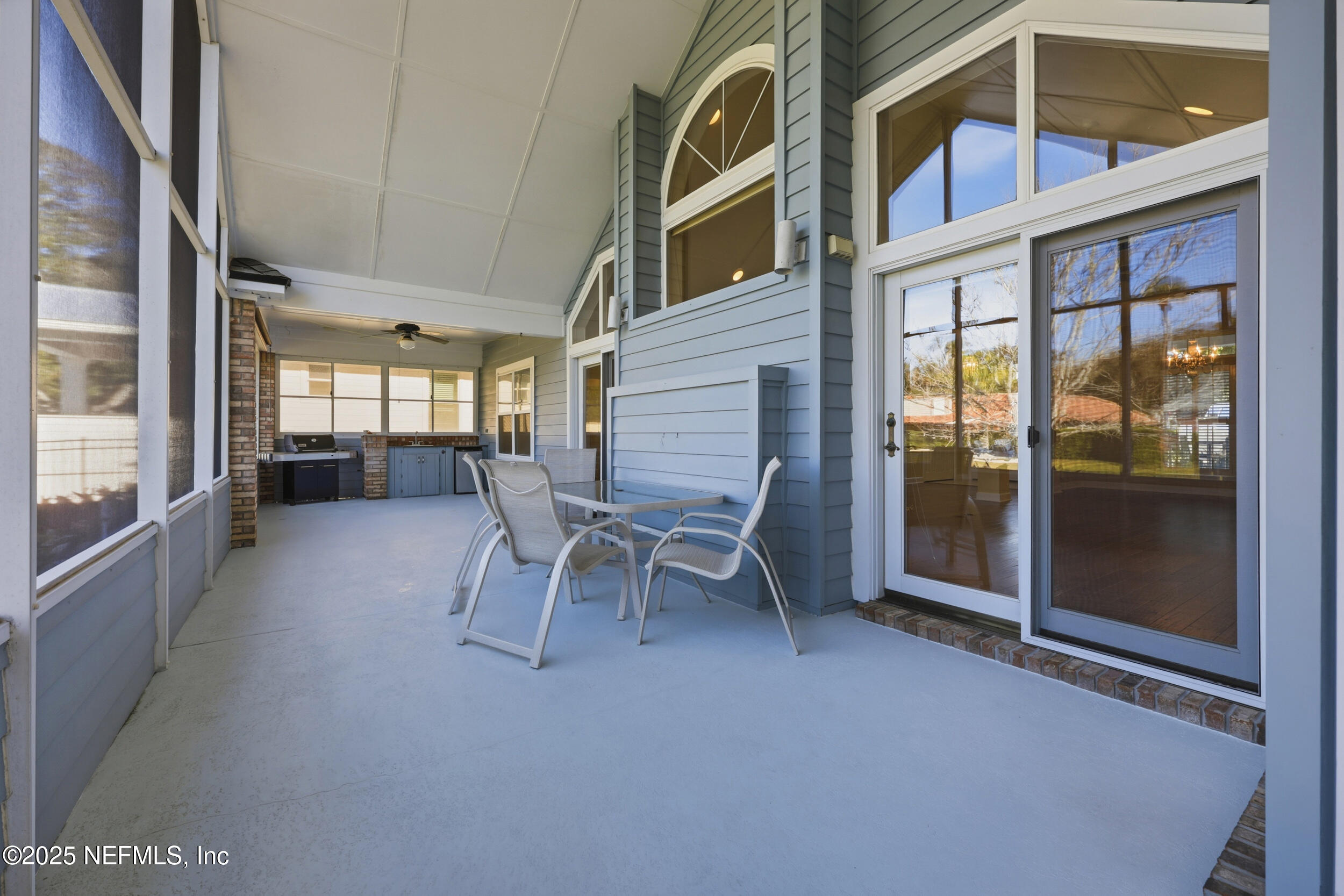 2332 Fiddlers Lane Atlantic Beach, FL 32233 - Photo 45 of 56 a dining room with furniture and a floor to ceiling window