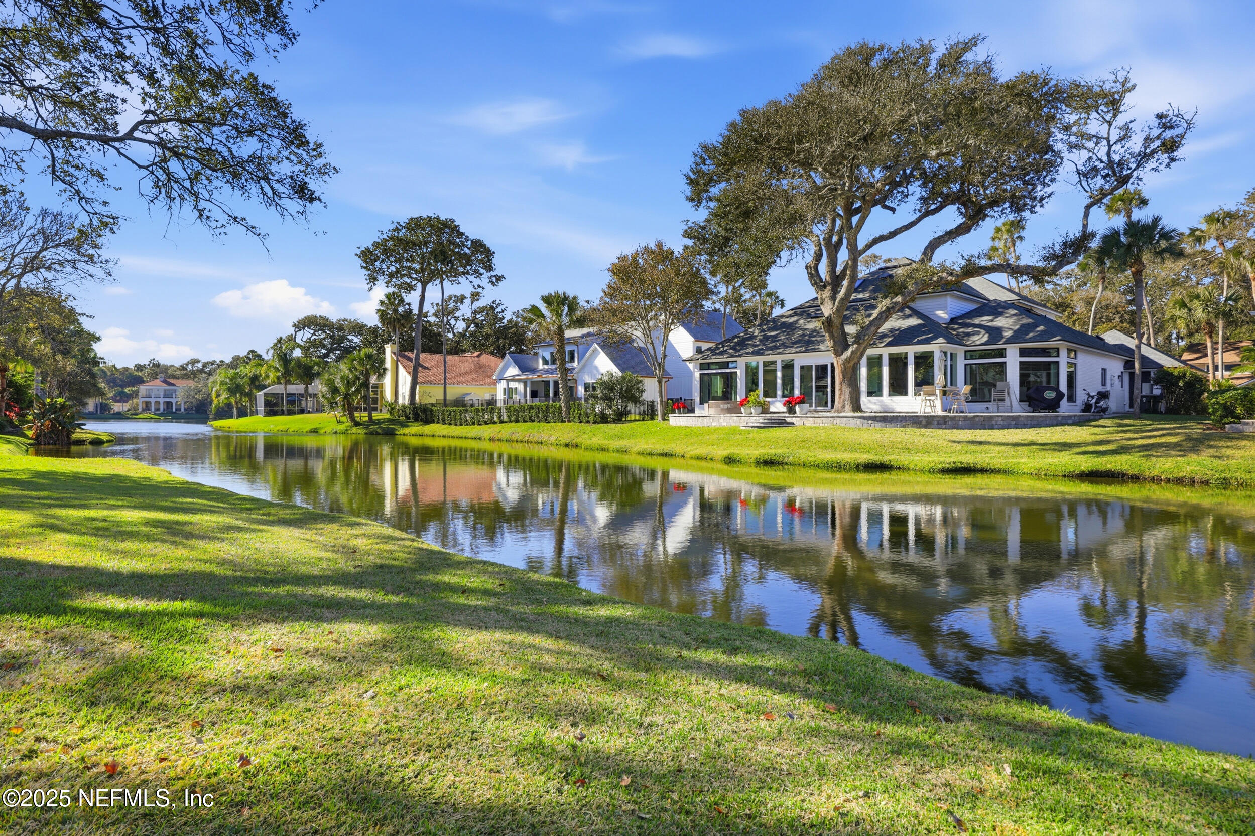 2332 Fiddlers Lane Atlantic Beach, FL 32233 - Photo 48 of 56 a view of swimming pool with outdoor seating and trees in the background