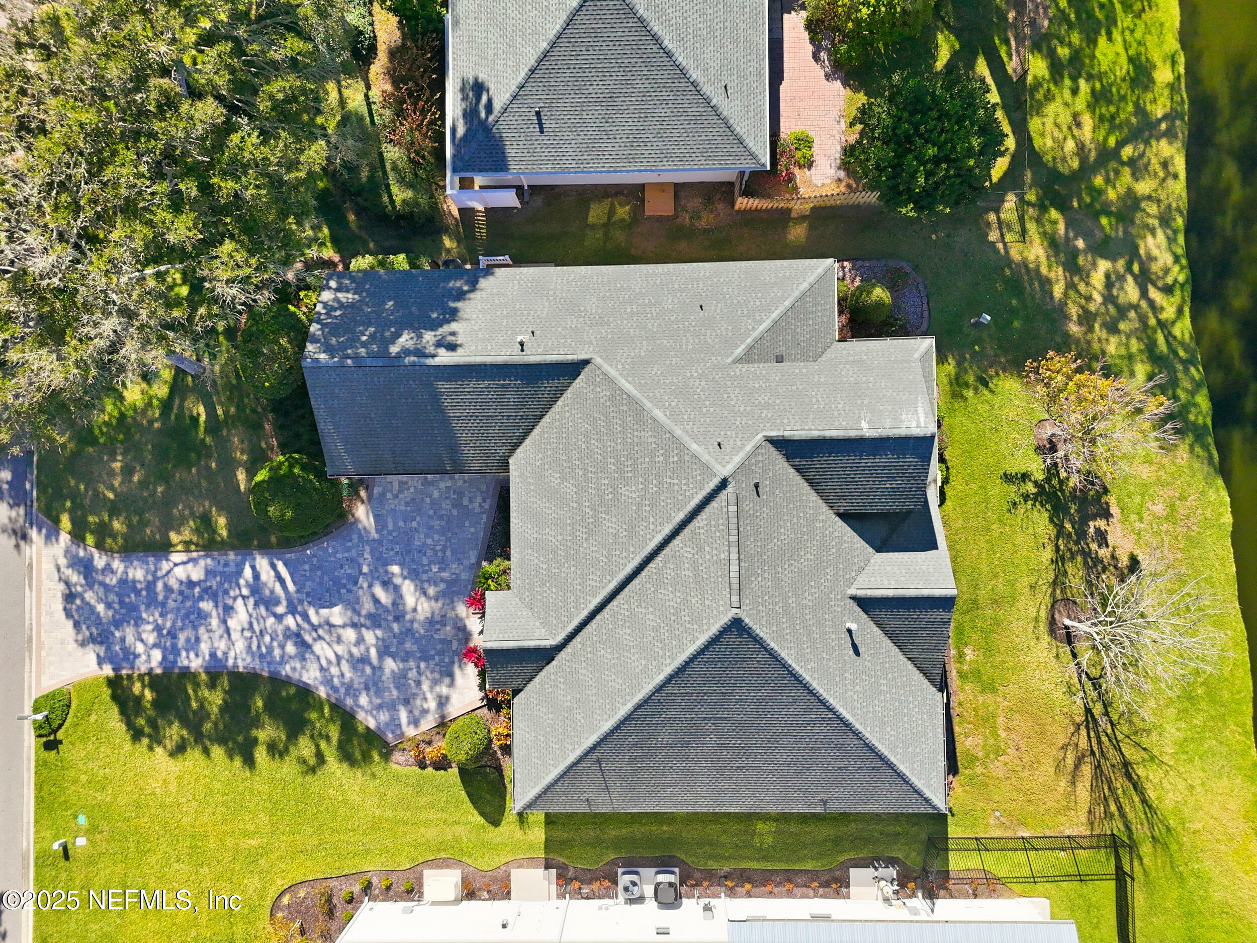 2332 Fiddlers Lane Atlantic Beach, FL 32233 - Photo 49 of 56 an aerial view of a house with a yard