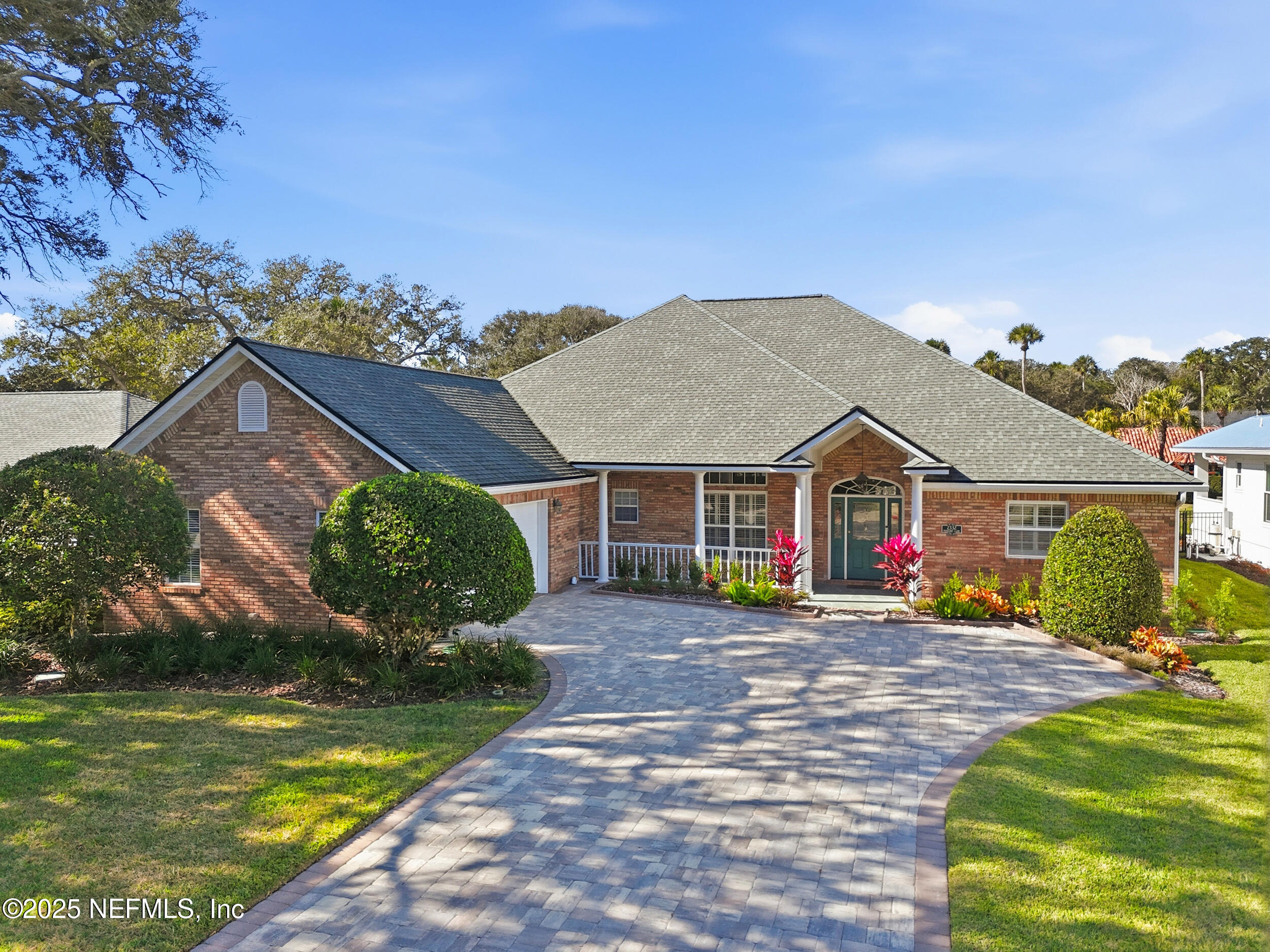 2332 Fiddlers Lane Atlantic Beach, FL 32233 - Photo 53 of 56 a view of a house with a big yard and potted plants