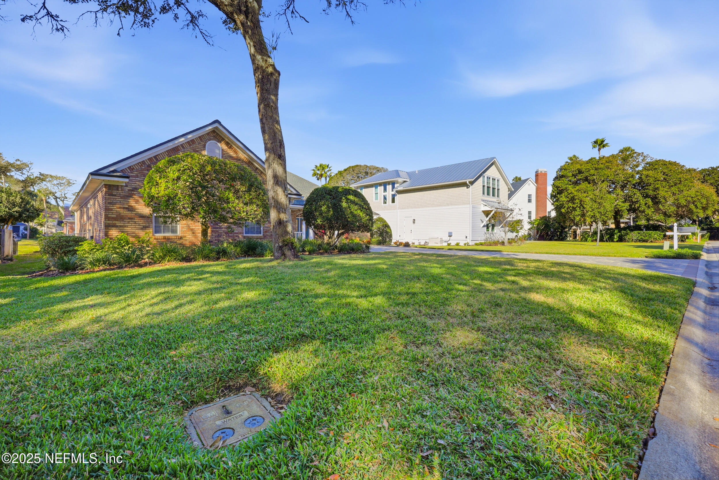 2332 Fiddlers Lane Atlantic Beach, FL 32233 - Photo 54 of 56 a view of a house with a yard and plants