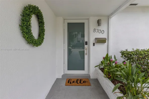 view of a potted plant in front of a door