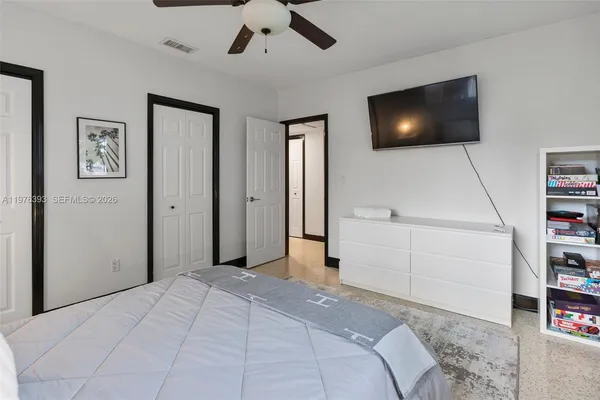a view of a hallway with workspace and mirror