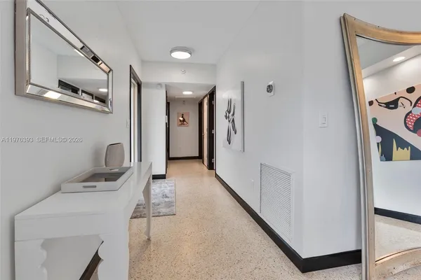 a close view of water heater room with washer and dryer