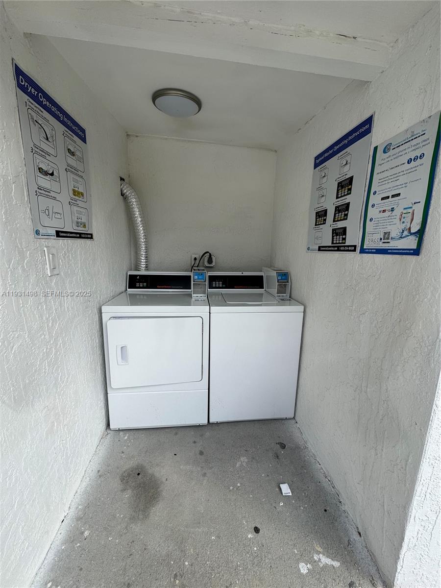 2146 Northwest 18th Terrace, Unit B Miami, FL 33125 - Photo 18 of 19 a utility room with dryer and washer