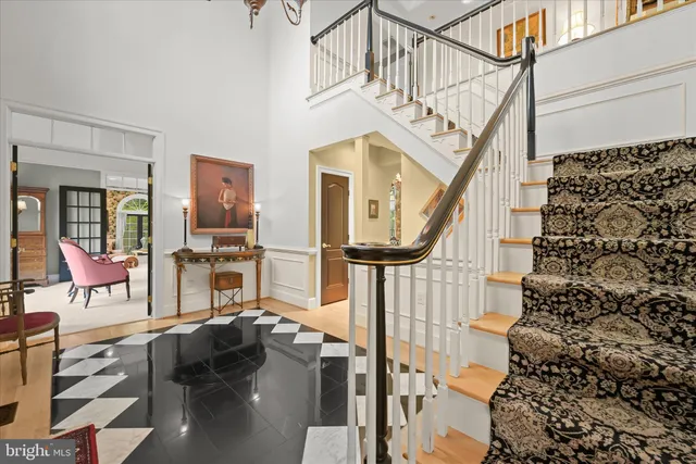 a view of entryway livingroom and hall with wooden floor