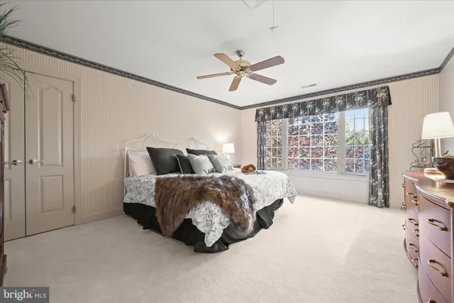 a kitchen with stainless steel appliances granite countertop a sink and a refrigerator