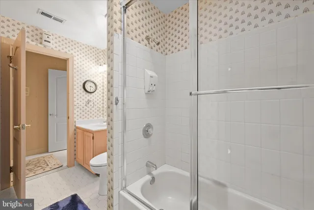 a view of a porch with wooden floor and furniture