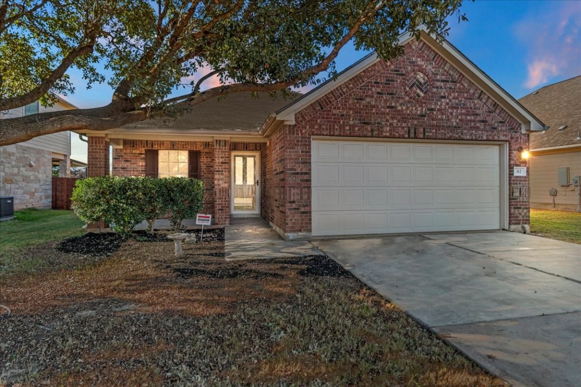 312 Falcon Lane Leander, TX 78641 - Photo 1 of 1 a front view of a house with a yard