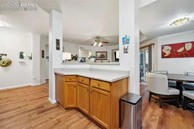 a kitchen with stainless steel appliances granite countertop a sink and a refrigerator