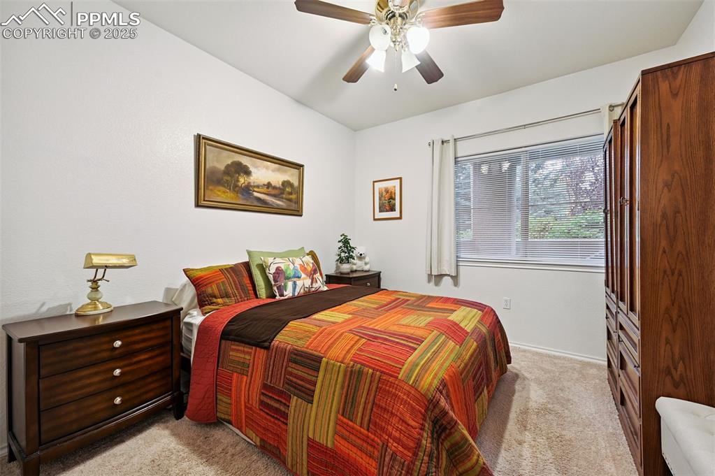 4007 Riviera Grove, Unit 103 Colorado Springs, CO 80922 - Photo 12 of 22 a bedroom with bed and window