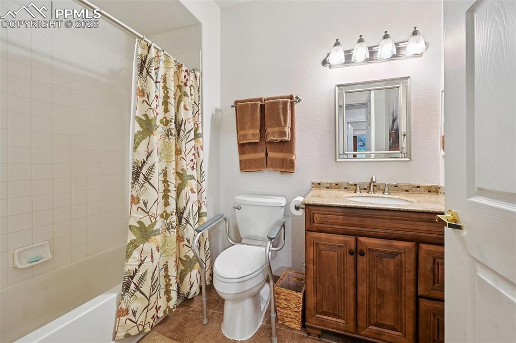 4007 Riviera Grove, Unit 103 Colorado Springs, CO 80922 - Photo 16 of 22 a bathroom with a sink toilet and shower