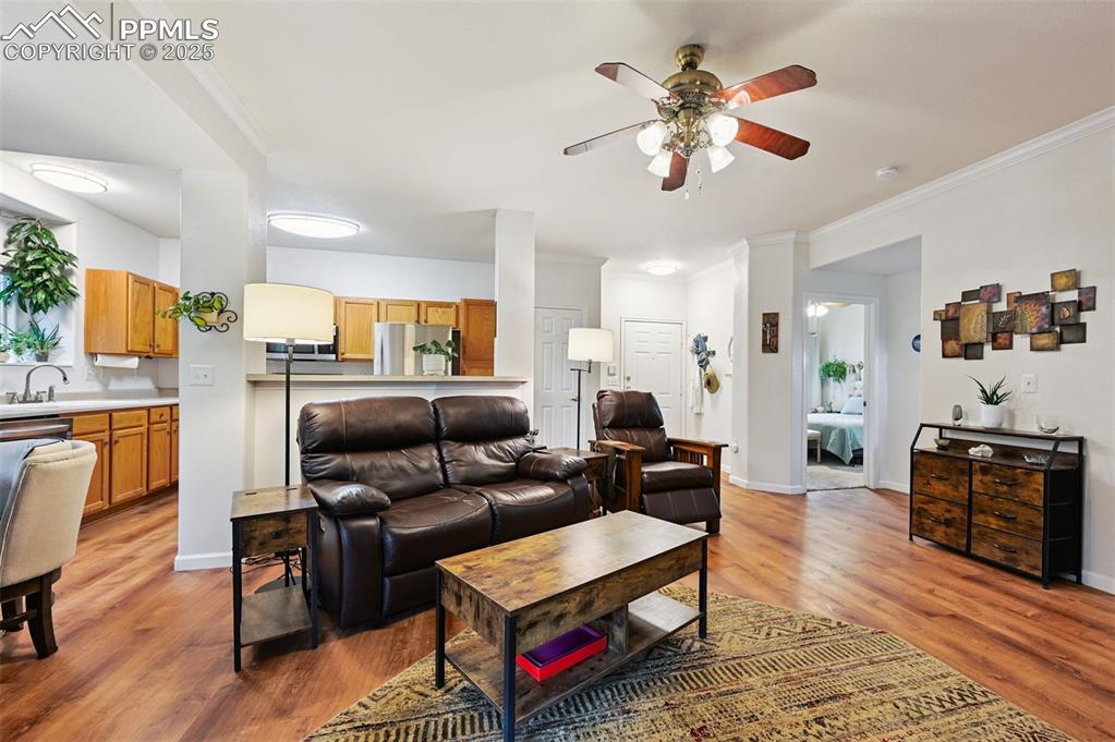 4007 Riviera Grove, Unit 103 Colorado Springs, CO 80922 - Photo 8 of 22 a living room with furniture fireplace and flat screen tv