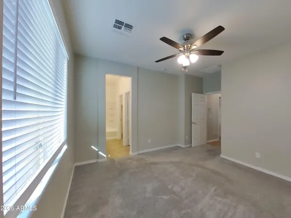 a kitchen with stainless steel appliances granite countertop a sink a stove and a microwave