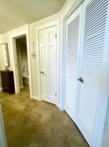 a bathroom with double vanity sinks and a mirror