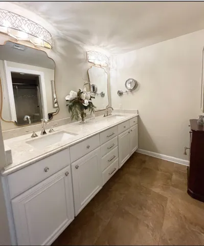 a bathroom with a glass shower door and a toilet