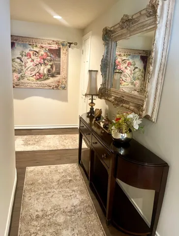 a bathroom with a sink a vanity and a large mirror