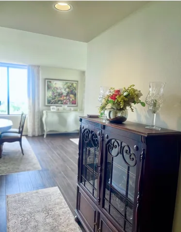a view of a dining room with furniture window and wooden floor