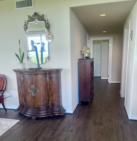 a view of a dining room with wooden floor